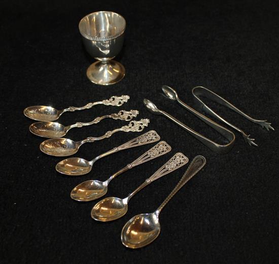 Six Continental spoons, an egg cup and spoon and two pairs of tongs